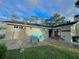 Spacious back patio with seating area and string lights at 730 Ne 18Th Ave, Ocala, FL 34470
