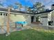 Back patio with seating area and double doors at 730 Ne 18Th Ave, Ocala, FL 34470