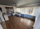 Bright sunroom with wood floors and comfy seating at 730 Ne 18Th Ave, Ocala, FL 34470