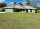 Charming single Gathering home with a freshly mowed lawn and an attached two car garage at 8949 Se 159Th Ln, Summerfield, FL 34491