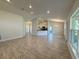 Open-concept living room featuring beautiful tiled floors and lots of natural light at 8949 Se 159Th Ln, Summerfield, FL 34491