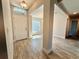 Inviting foyer showcasing tile flooring, a front door with transom window, and views into other rooms at 9869 Se 157Th Ln, Summerfield, FL 34491