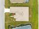 Aerial view showcases the home's neat roof, clean driveway, and well-maintained landscaping at 12576 Se 97Th Terrace Rd, Summerfield, FL 34491