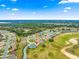 Aerial view of the home, highlighting its location near a golf course at 12576 Se 97Th Terrace Rd, Summerfield, FL 34491