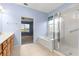 Bathroom with soaking tub, walk-in shower, and wood cabinets at 12576 Se 97Th Terrace Rd, Summerfield, FL 34491