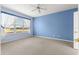 Bright bedroom with golf course view and ceiling fan at 12576 Se 97Th Terrace Rd, Summerfield, FL 34491