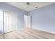 Bedroom with double-door closet and wood-look flooring at 12576 Se 97Th Terrace Rd, Summerfield, FL 34491