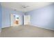 Spacious bedroom with light blue walls and carpeted floors at 12576 Se 97Th Terrace Rd, Summerfield, FL 34491