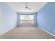 Serene bedroom with golf course view and ceiling fan at 12576 Se 97Th Terrace Rd, Summerfield, FL 34491