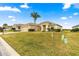 Single-story home with a double-door entry and garage at 12576 Se 97Th Terrace Rd, Summerfield, FL 34491