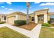 House exterior featuring a double door entry and walkway at 12576 Se 97Th Terrace Rd, Summerfield, FL 34491
