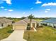 Well-maintained single-Gathering home with a two-car garage, lush lawn, and a beautifully landscaped yard at 12576 Se 97Th Terrace Rd, Summerfield, FL 34491