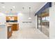 Open kitchen with island and view of the screened porch at 12576 Se 97Th Terrace Rd, Summerfield, FL 34491