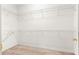 Large walk-in closet with wire shelving and carpeting at 12576 Se 97Th Terrace Rd, Summerfield, FL 34491