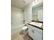 Bathroom features a shower-tub combo, vanity with dark countertops, and tile flooring at 3127 Ne 45Th Ave, Ocala, FL 34470
