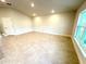 A bedroom featuring beautiful tile, a large window letting in lots of light, and neutral paint at 3127 Ne 45Th Ave, Ocala, FL 34470