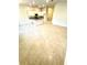 Spacious open-concept living area with tile floors, neutral walls, and recessed lighting, adjacent to the kitchen at 3127 Ne 45Th Ave, Ocala, FL 34470