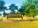 The Oak Hill Plantation entrance sign surrounded by lovely plants and grass at 3127 Ne 45Th Ave, Ocala, FL 34470