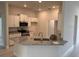 Modern kitchen featuring granite countertops, white cabinets, and stainless steel appliances at 7143 Sw 179Th Court Rd, Dunnellon, FL 34432