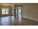 Spacious open floor plan living room with tile flooring and large windows at 7143 Sw 179Th Court Rd, Dunnellon, FL 34432