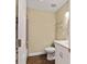 Bathroom features a toilet, vanity, and a tiled shower with glass shelves at 9068 Sw 82Nd Ter # A, Ocala, FL 34481