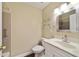 This bathroom features a toilet, vanity, and a tiled shower with a grab bar at 9068 Sw 82Nd Ter # A, Ocala, FL 34481