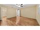 Bedroom with neutral walls, hardwood floors, walk-in closet, and a ceiling fan at 9068 Sw 82Nd Ter # A, Ocala, FL 34481