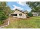 View of the rear of the home showing the sunroom and lawn at 9068 Sw 82Nd Ter # A, Ocala, FL 34481