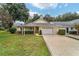 Beautiful home with a manicured lawn and a two-car garage at 9068 Sw 82Nd Ter # A, Ocala, FL 34481
