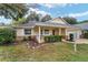 A charming house featuring stone accents and a well-manicured yard at 9068 Sw 82Nd Ter # A, Ocala, FL 34481