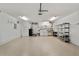 A garage with a washer, dryer, utility sink, and storage shelves at 9068 Sw 82Nd Ter # A, Ocala, FL 34481