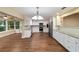 Updated kitchen with white cabinets, stainless steel appliances and large breakfast area at 9068 Sw 82Nd Ter # A, Ocala, FL 34481