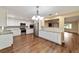 Well-lit kitchen featuring white cabinets, stainless steel appliances, and granite countertops at 9068 Sw 82Nd Ter # A, Ocala, FL 34481