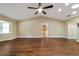 Spacious living room with vaulted ceilings, wood-look floors, and ample natural light at 9068 Sw 82Nd Ter # A, Ocala, FL 34481