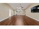 Open living room features hardwood floors, neutral paint, recessed lighting and a ceiling fan at 9068 Sw 82Nd Ter # A, Ocala, FL 34481