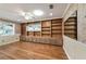 Living room with built in cabinets and shelving. Hardwood floors and decorative wall paper at 9068 Sw 82Nd Ter # A, Ocala, FL 34481