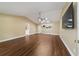 Spacious living room featuring wood floors, neutral walls, and a modern ceiling fan at 9068 Sw 82Nd Ter # A, Ocala, FL 34481