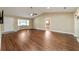 Spacious living room with vaulted ceilings, wood-look floors, and ample natural light at 9068 Sw 82Nd Ter # A, Ocala, FL 34481