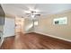 Spacious main bedroom with wood-look flooring, ceiling fan and ensuite bathroom at 9068 Sw 82Nd Ter # A, Ocala, FL 34481