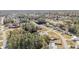 A neighborhood view showcasing well-maintained lawns, tree coverage, and residential streets in a serene suburban setting at 33 Pecan Pass Run, Ocala, FL 34472