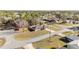 Aerial view of a house with beautiful surroundings and streets with power lines at 33 Pecan Pass Run, Ocala, FL 34472