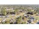 Expansive aerial view of a residential area, showcasing homes among lush greenery at 33 Pecan Pass Run, Ocala, FL 34472