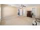 Bedroom with two windows, ceiling fan, dresser and doorway to ensuite at 33 Pecan Pass Run, Ocala, FL 34472