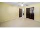 Bright bedroom featuring a ceiling fan, closet, and an ensuite bathroom at 33 Pecan Pass Run, Ocala, FL 34472