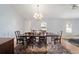 Dining room with hardwood floors, chandelier, and plenty of light at 33 Pecan Pass Run, Ocala, FL 34472