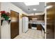 Efficient kitchen layout features wood cabinets, white appliances, and a convenient skylight at 33 Pecan Pass Run, Ocala, FL 34472