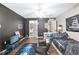 This bedroom features a ceiling fan, dark accent wall, and a connected bathroom at 4535 Se 32Nd Pl, Ocala, FL 34480