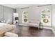 Large primary bedroom showcasing the seating area, and natural light from the many windows at 4535 Se 32Nd Pl, Ocala, FL 34480