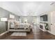 Primary bedroom with a fireplace, seating area, accent wall, and gorgeous chandelier at 4535 Se 32Nd Pl, Ocala, FL 34480