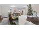 Dining room featuring a large wooden table adjacent to the entry foyer at 4535 Se 32Nd Pl, Ocala, FL 34480